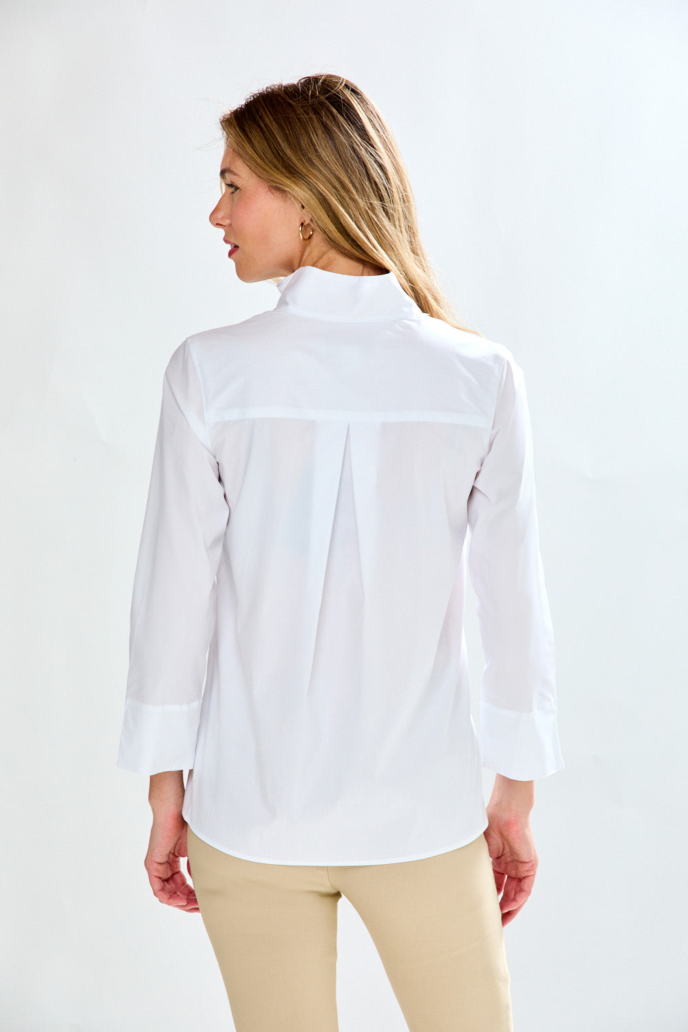 Woman in white blouse with ruffle