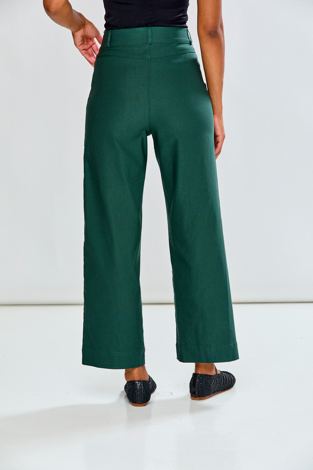 Woman in evergreen wide leg pant