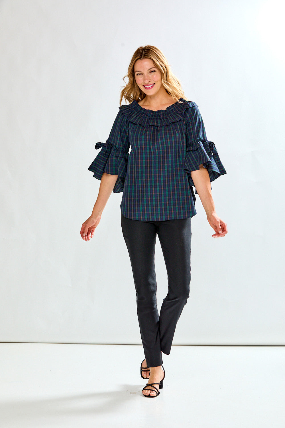 Woman in plaid on/off shoulder top