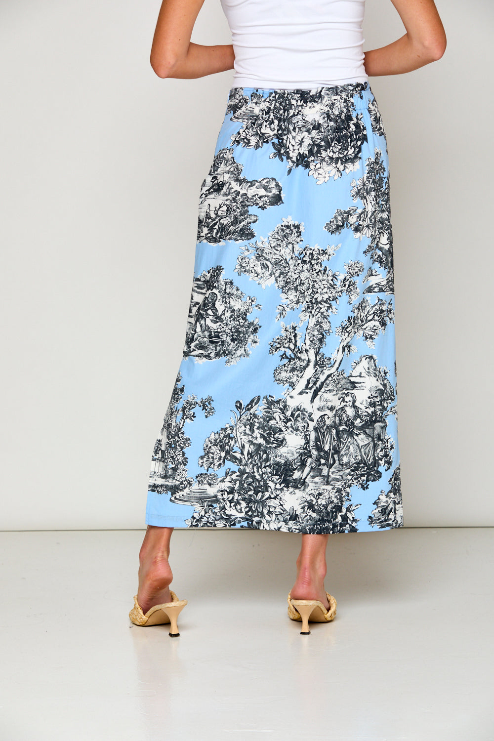 Woman in blue toile skirt