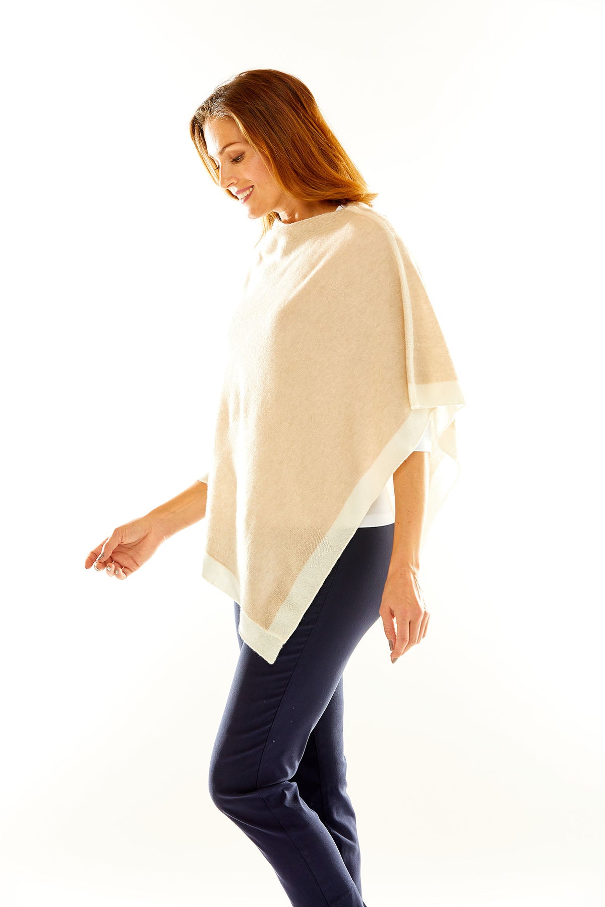 Woman in sand poncho