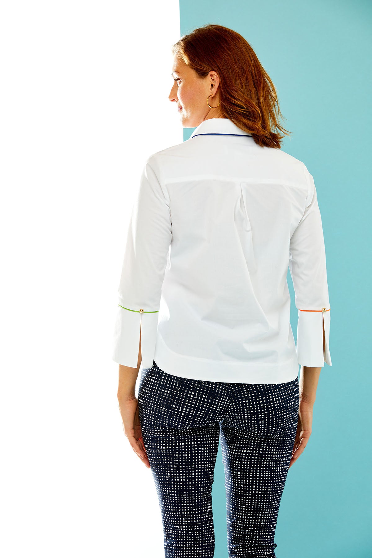 Woman in white shirt with contrast piping