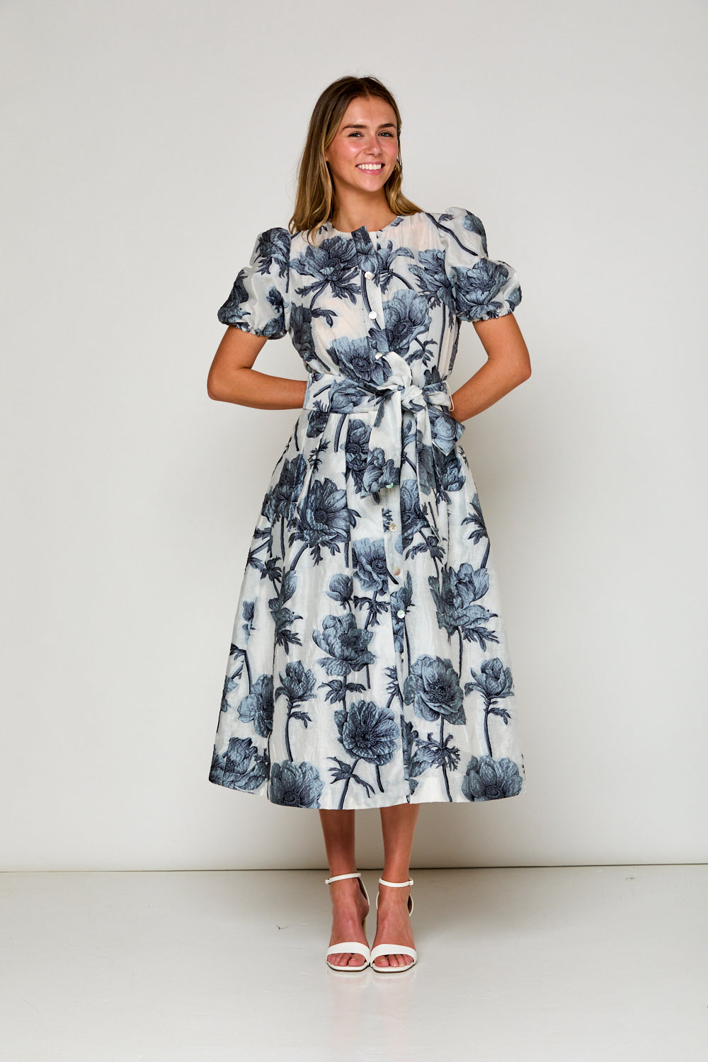 Woman in blue floral dress