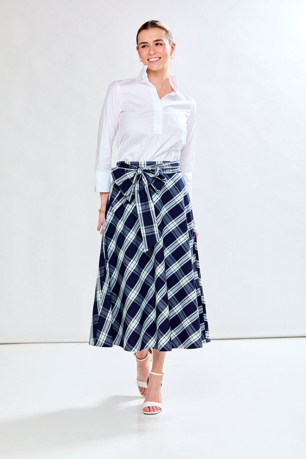 Woman in plaid skirt