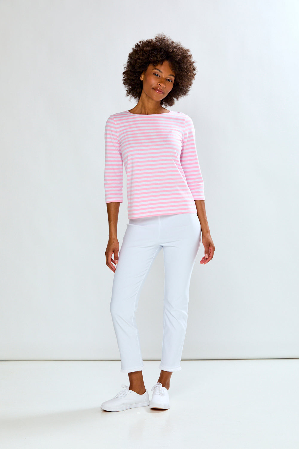 Woman in pink/white stripe knit top