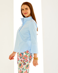 Woman in solid light blue blouse