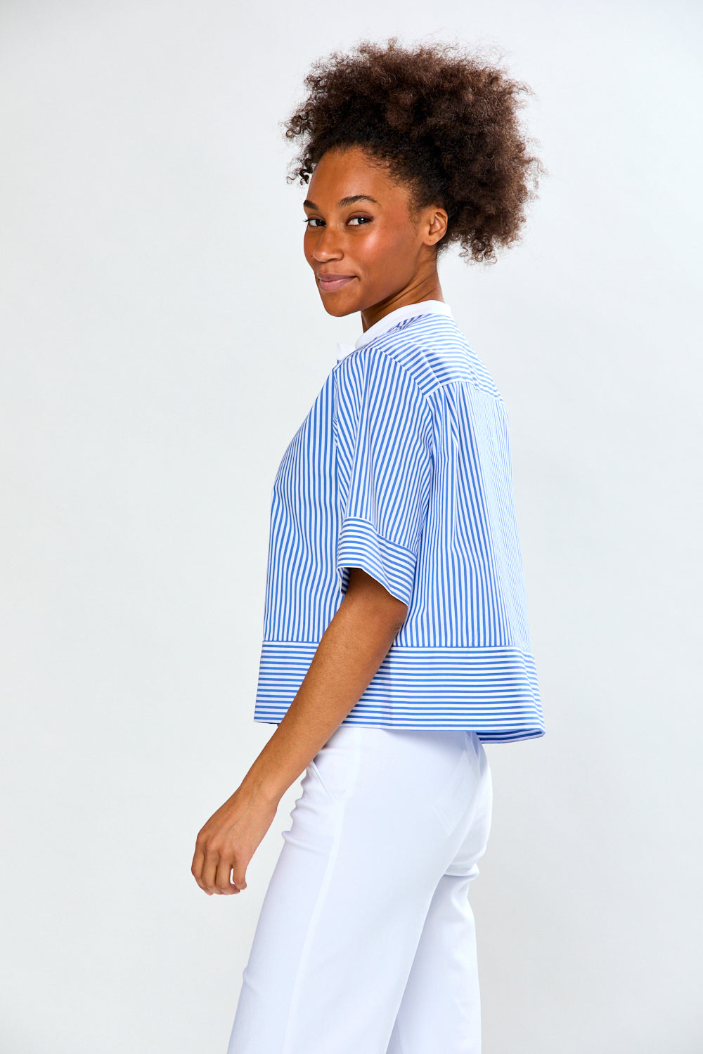 Woman in blue and white striped blouse