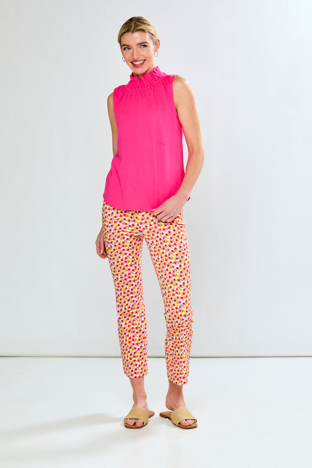 Woman in pink top and floral pants