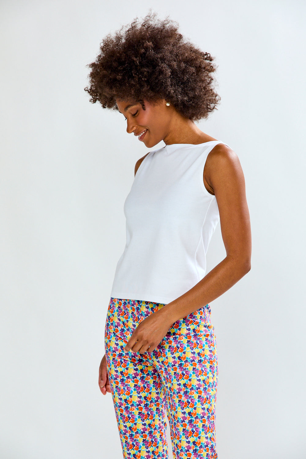 Woman in solid top and printed pants