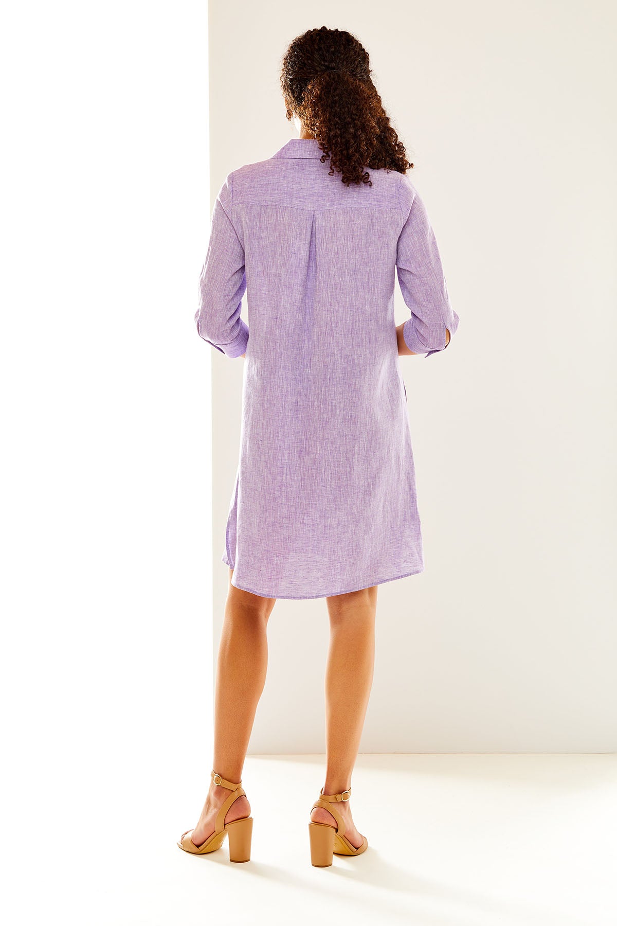 Woman in purple linen shirtdress