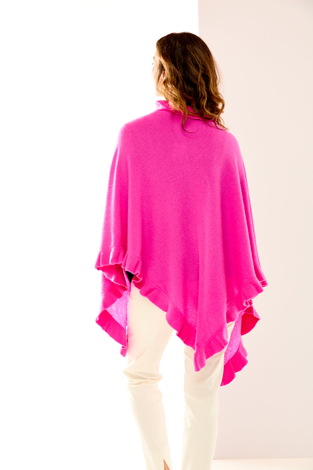 Woman in fuchsia cashmere triangle wrap
