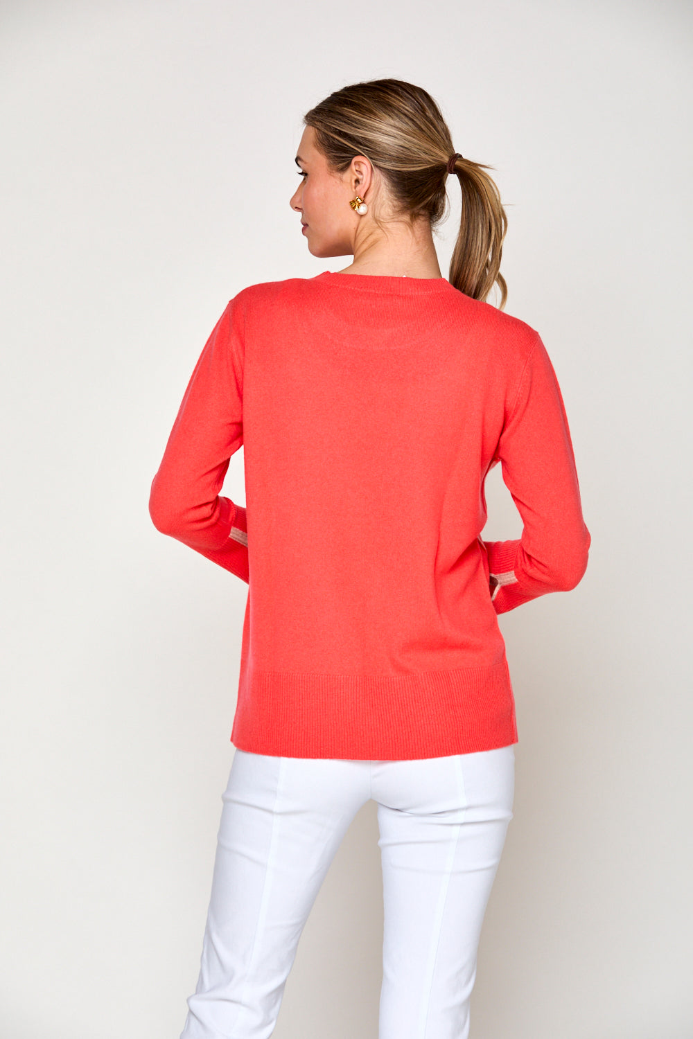 Woman in coral sweater