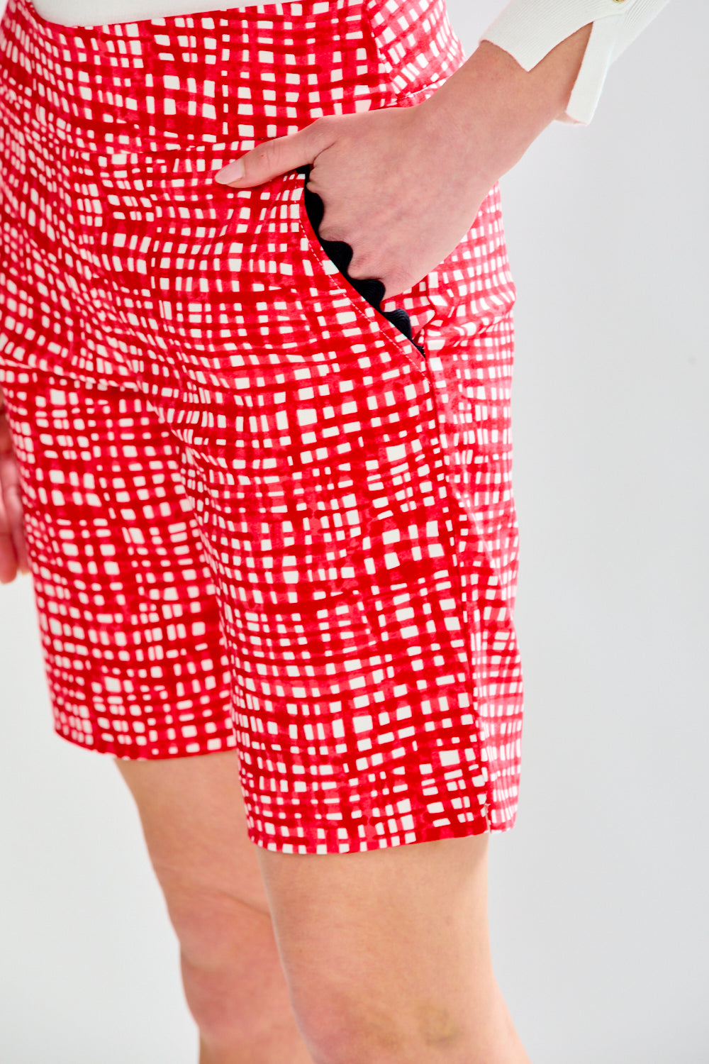 Woman in red pattern shorts