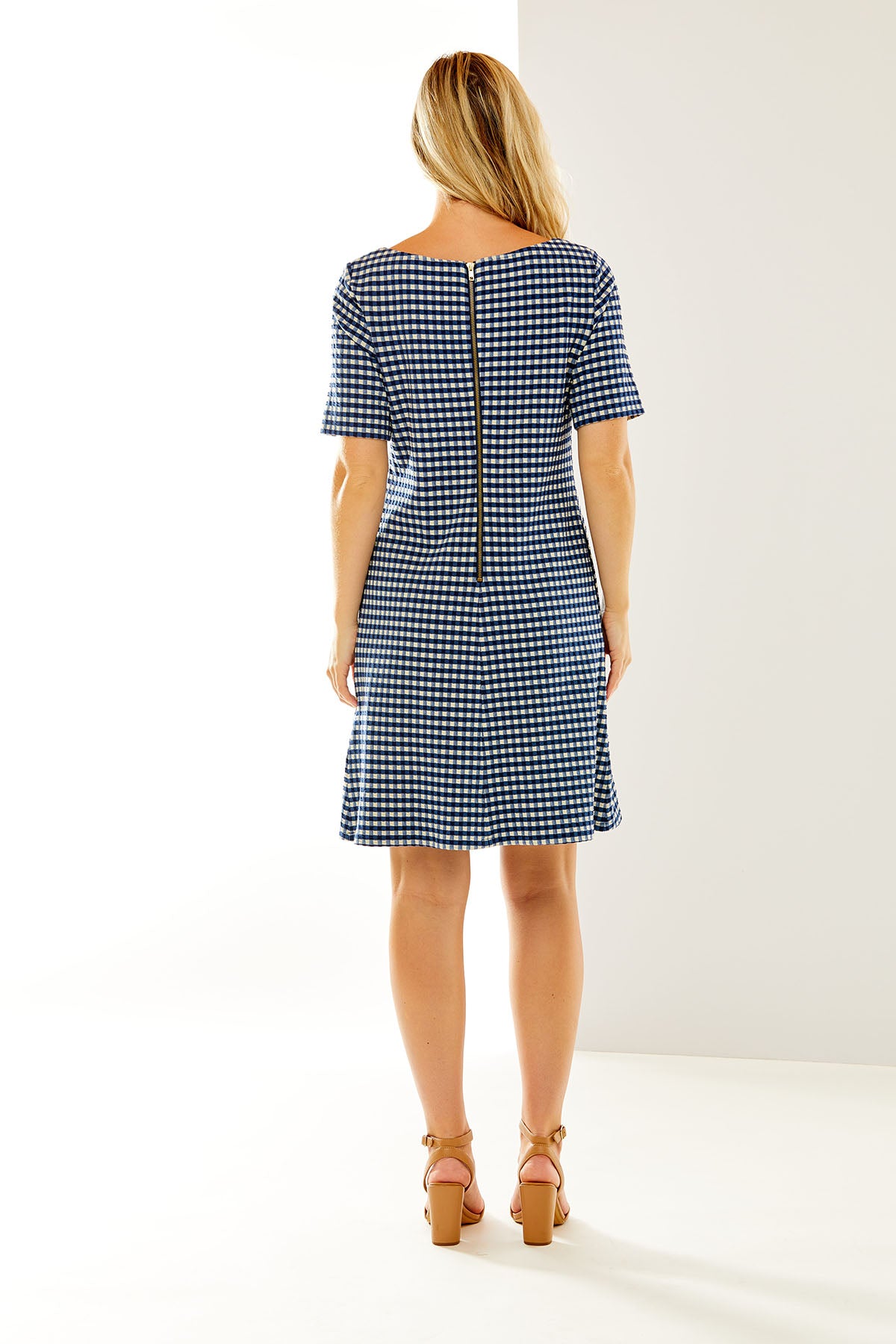 Woman in gingham dress