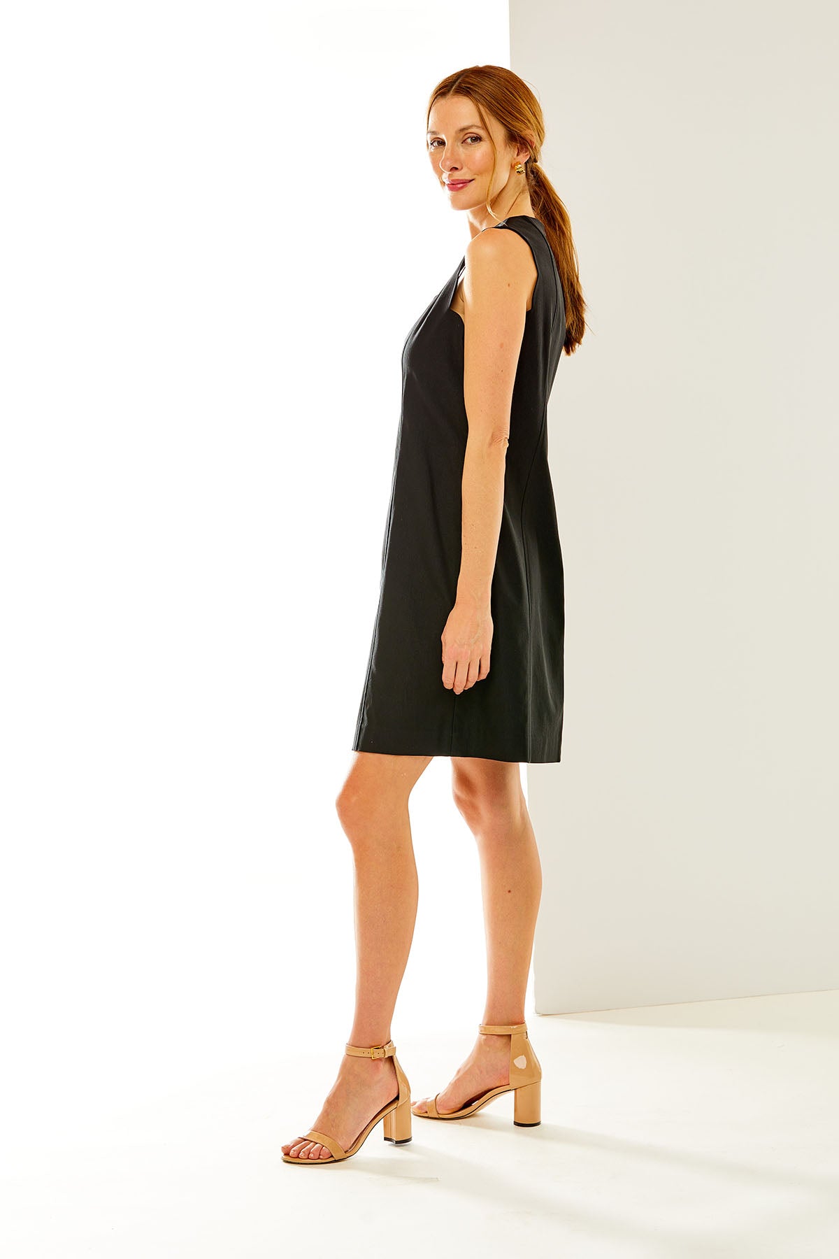 Woman in sleeveless black dress
