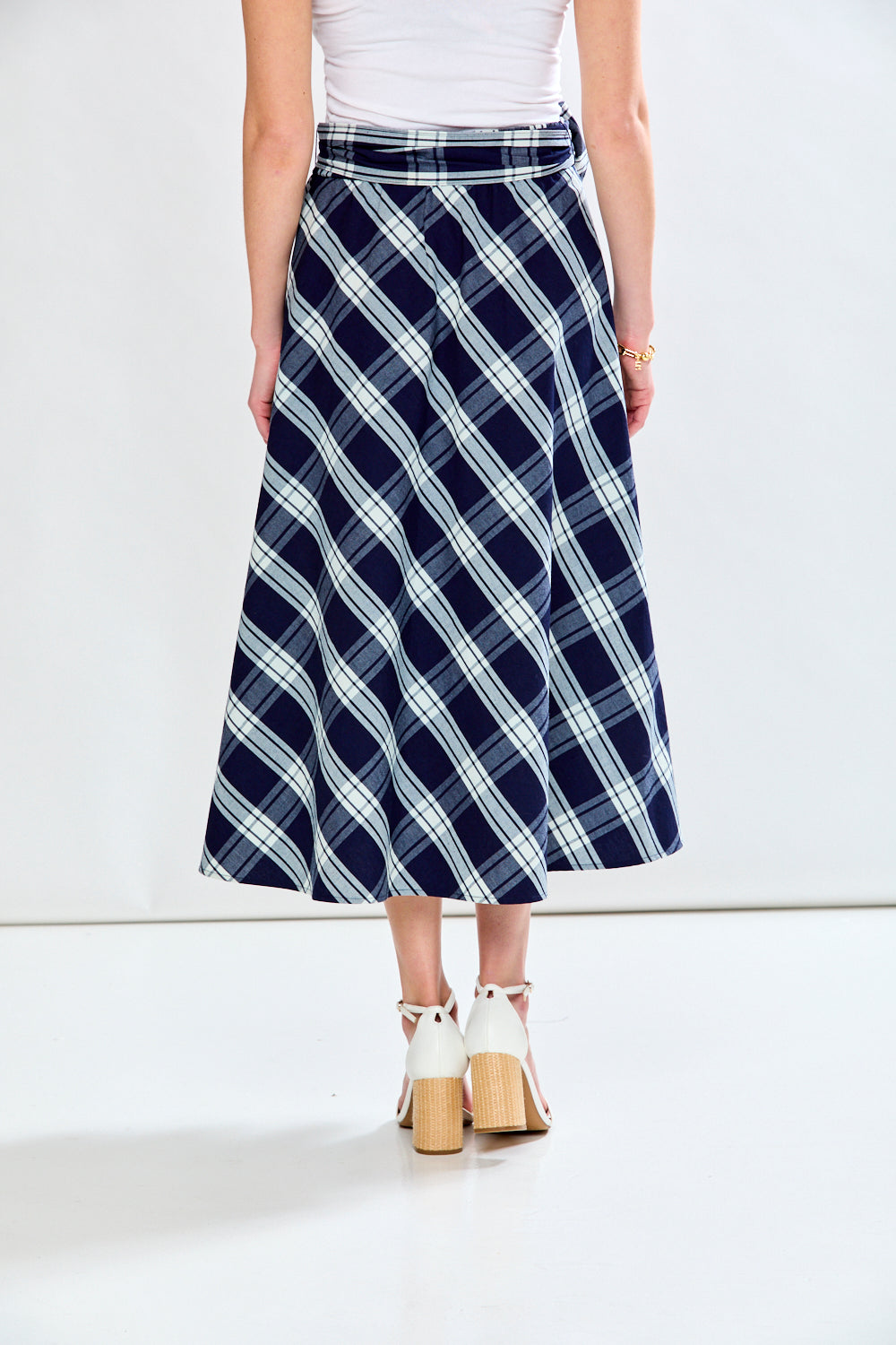 Woman in plaid skirt