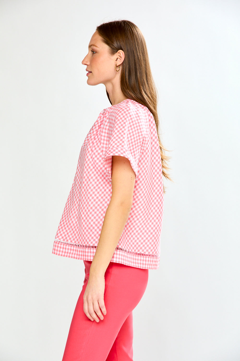 woman in pink gingham top