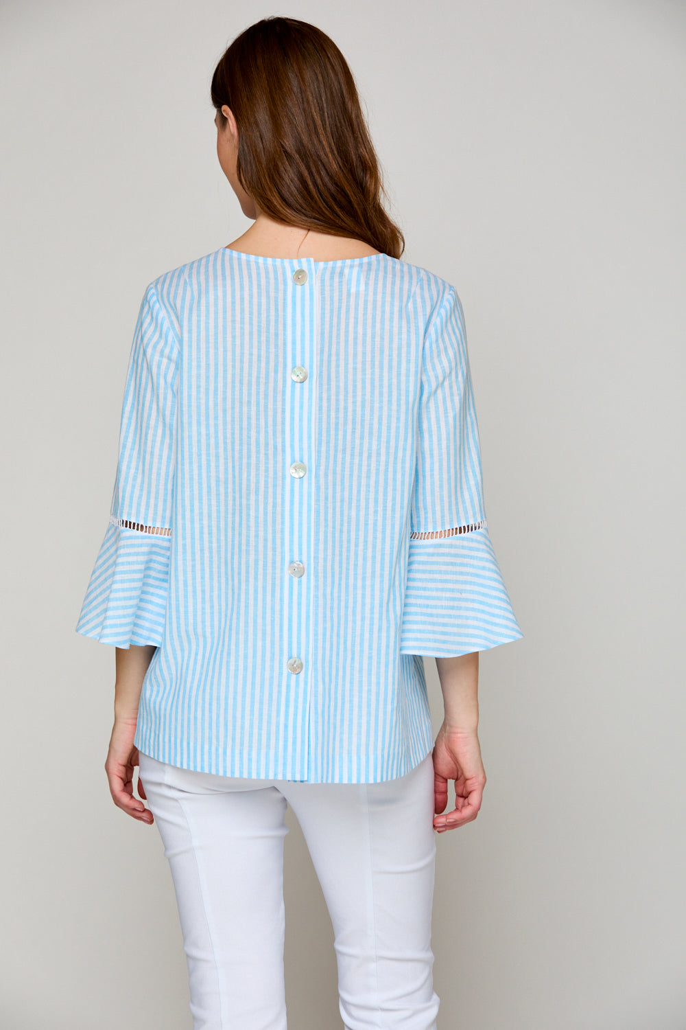 Woman in blue and white striped blouse