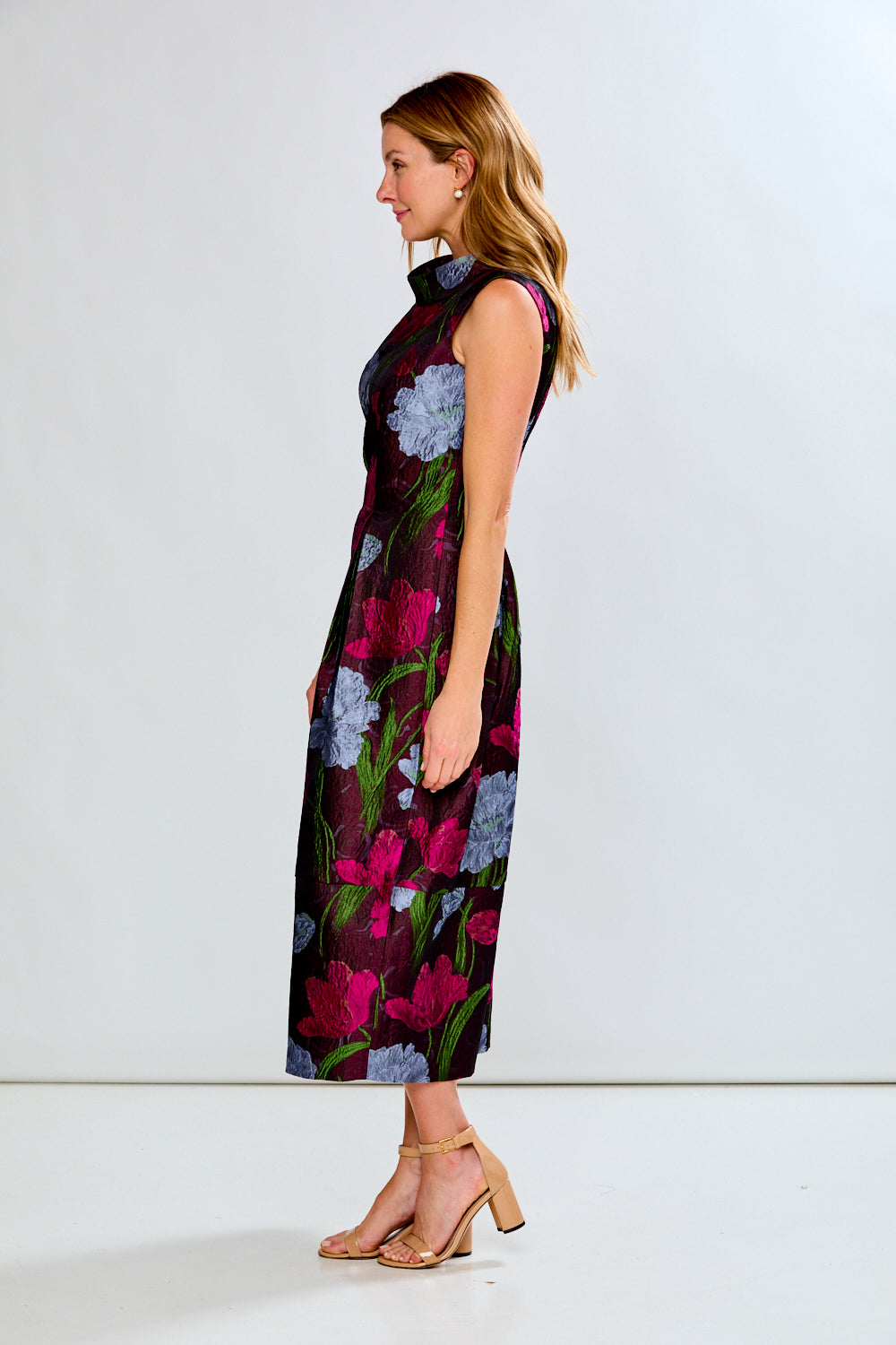 Woman wearing a floral dress on a white background