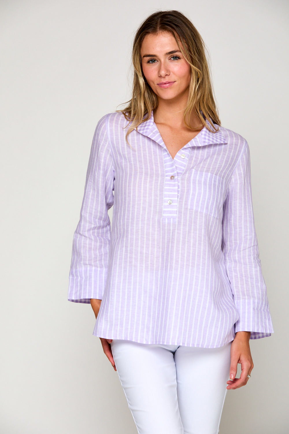 Woman in purple and white striped blouse