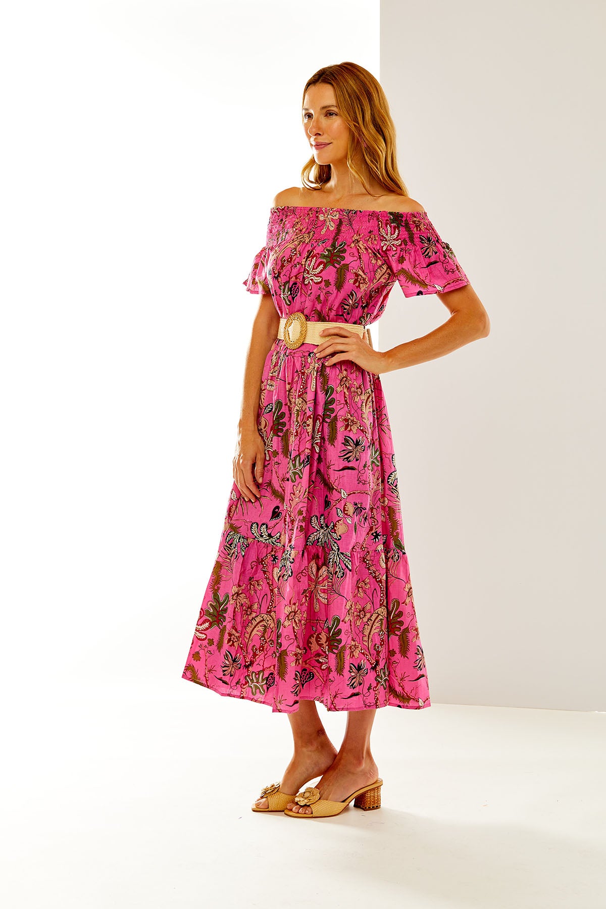Woman in fuchsia floral dress