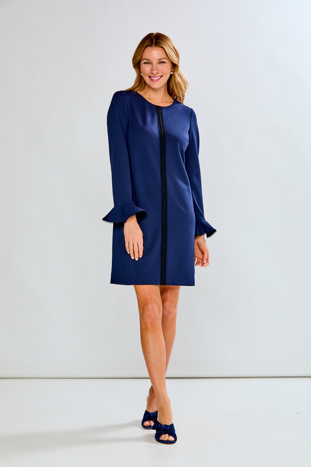Woman in navy crepe dress