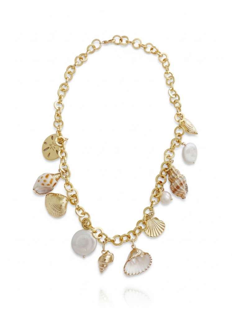 Gold bracelet with shell charms on a white background