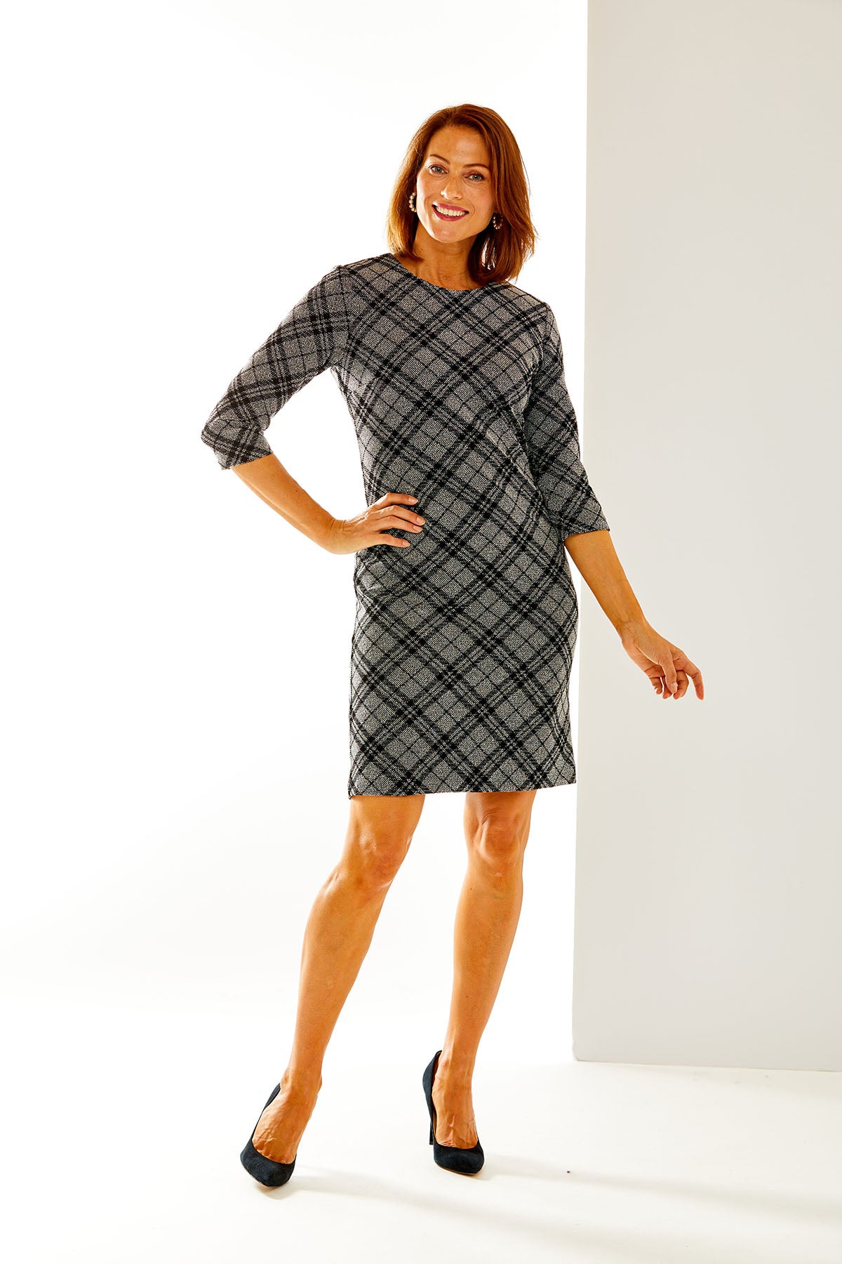 Woman in plaid dress