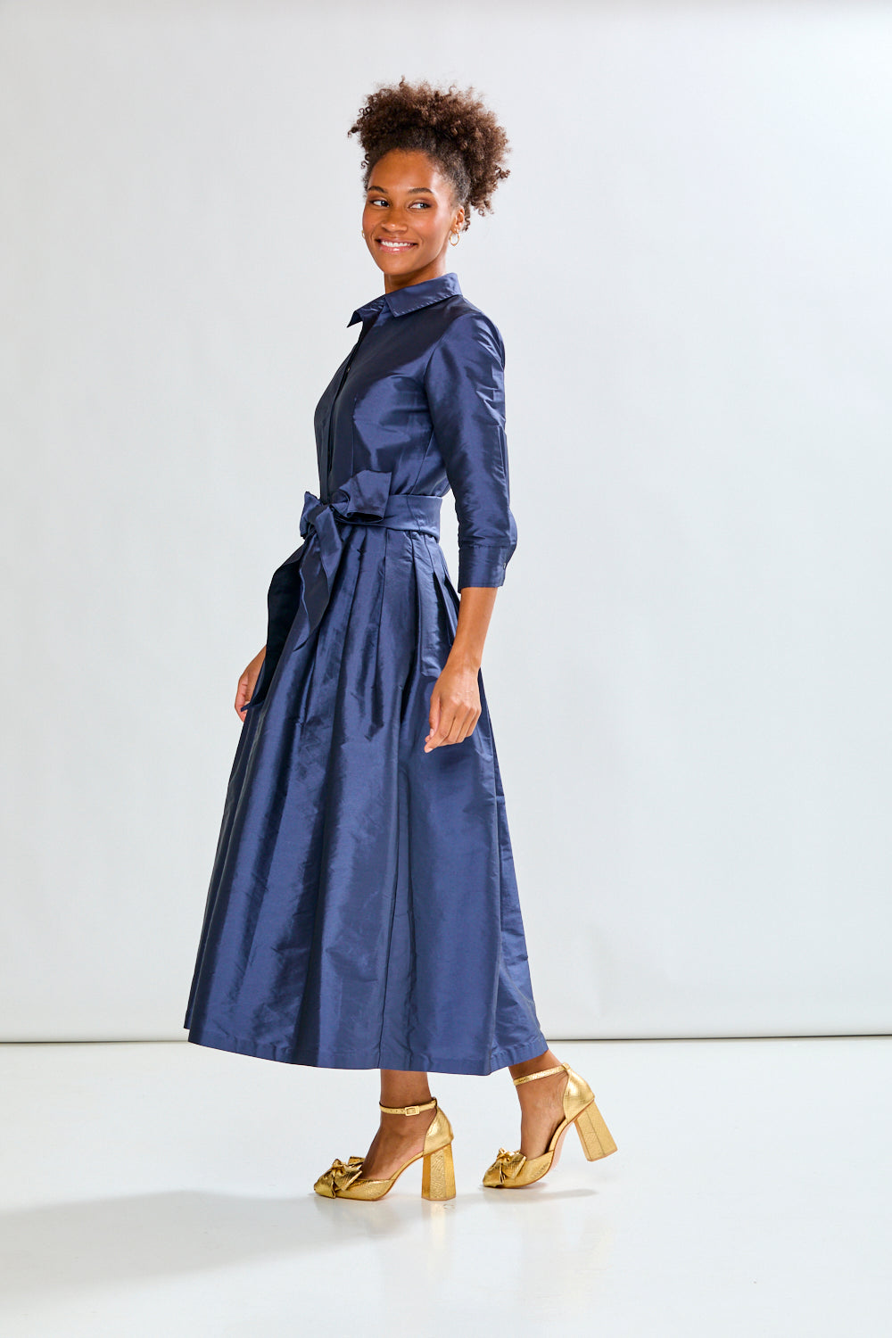 Woman in navy long taffeta dress
