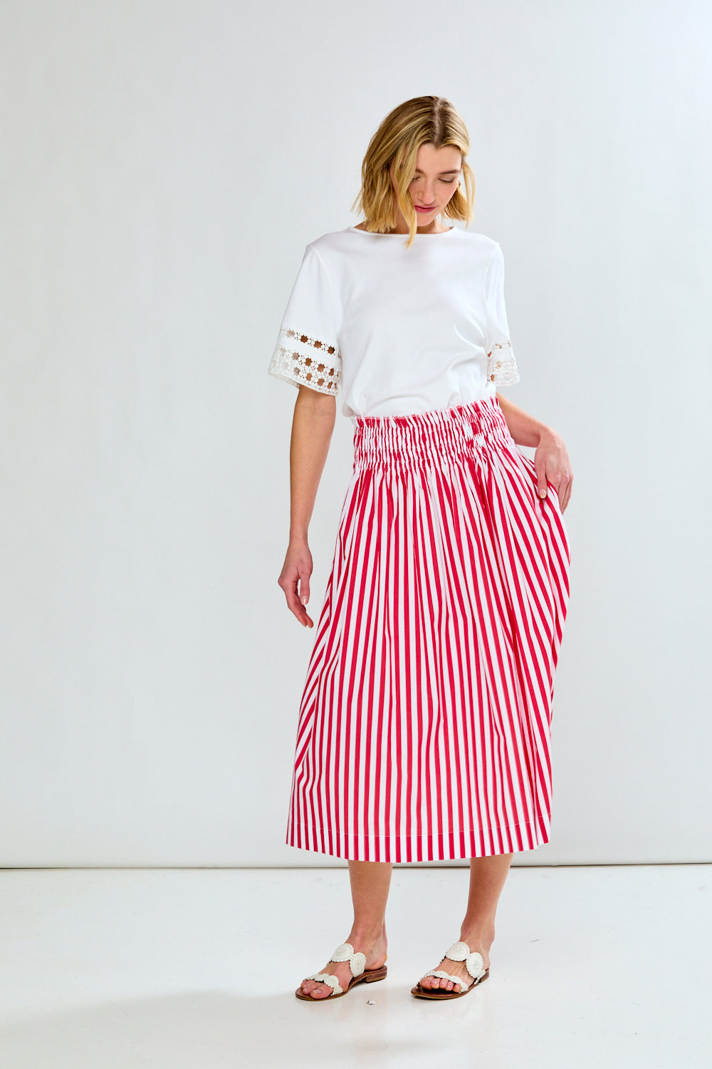 Woman in red & white stripe skirt