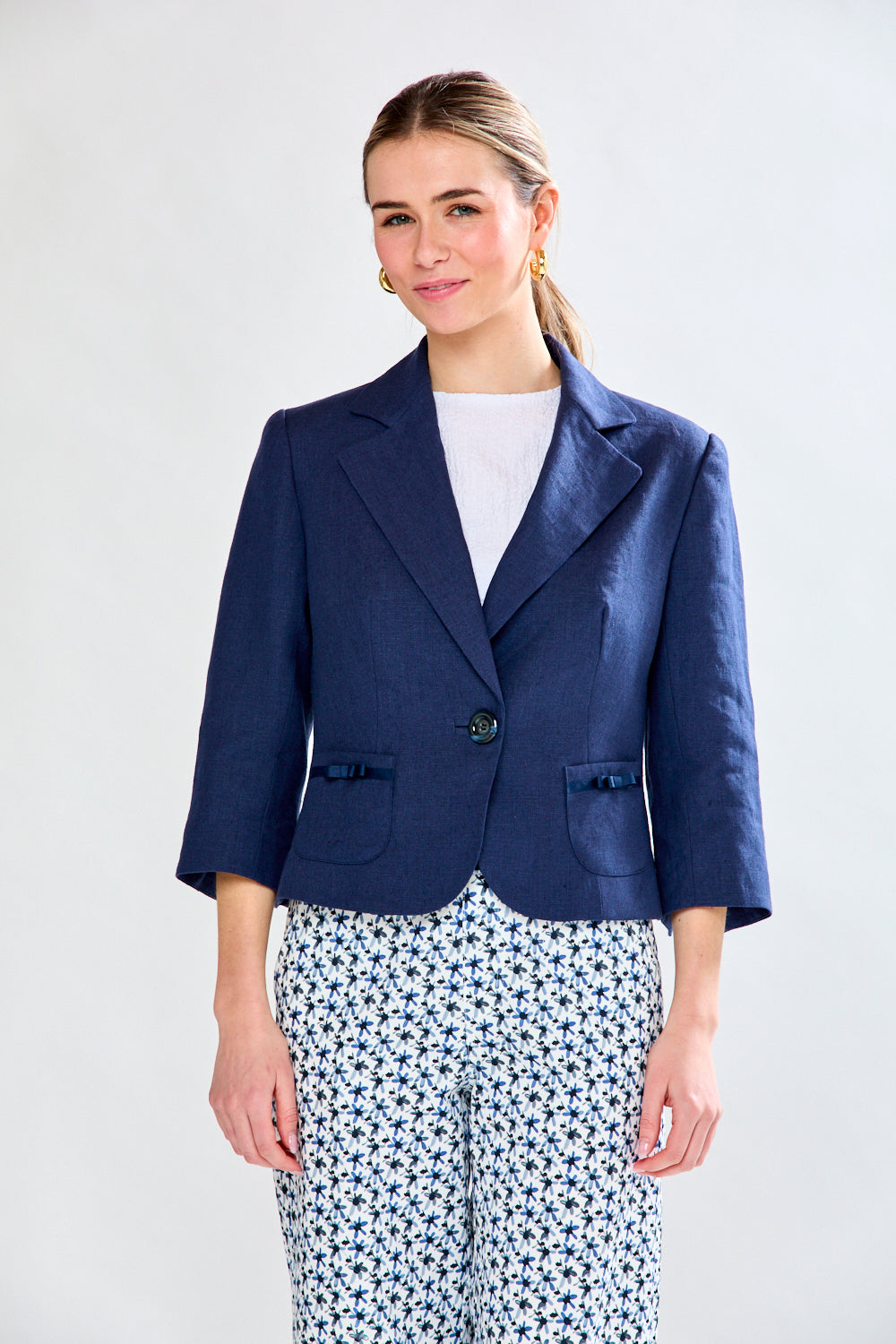 Woman in navy linen jacket