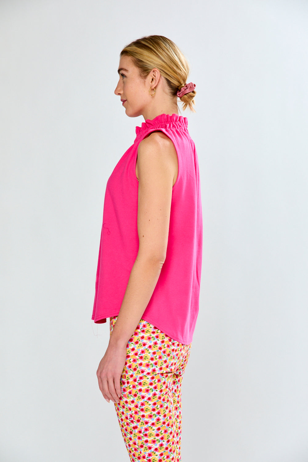 Woman in pink top and floral pants