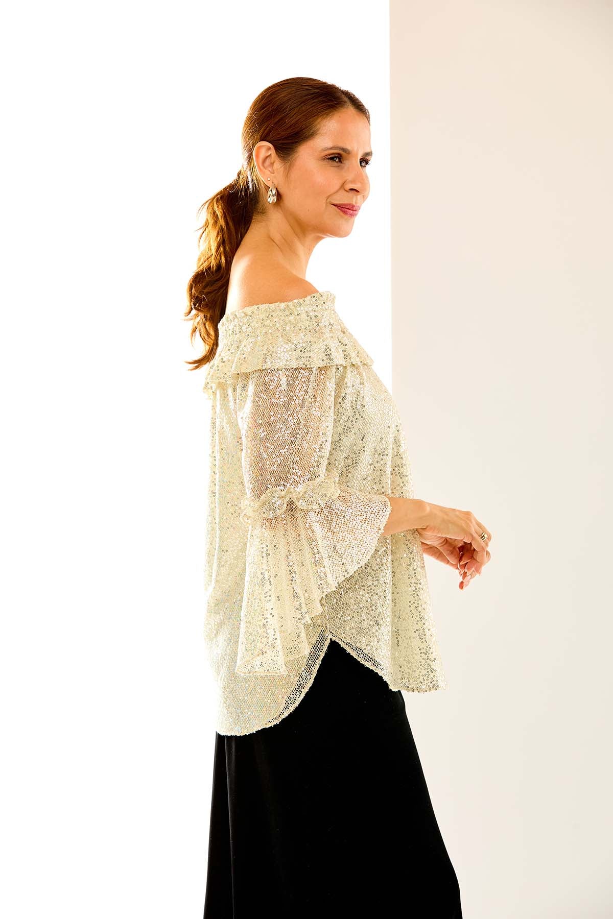 Woman in sequin mo blouse