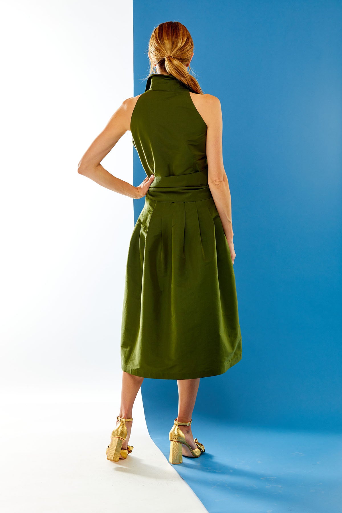 Woman in olive dress