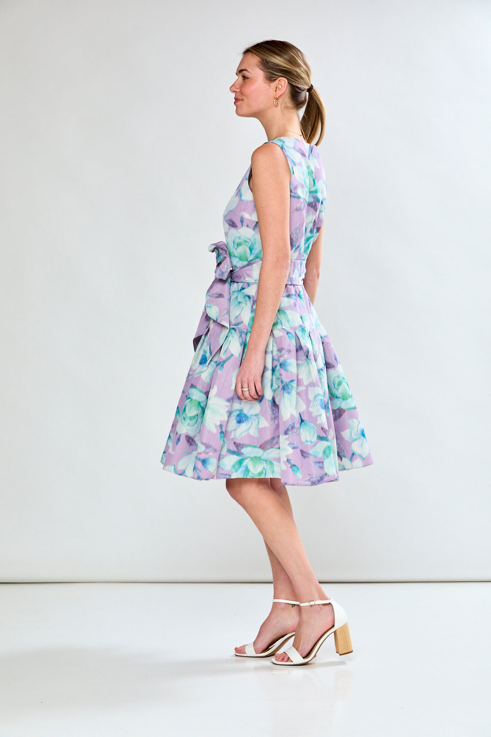 Woman in lilac floral dress