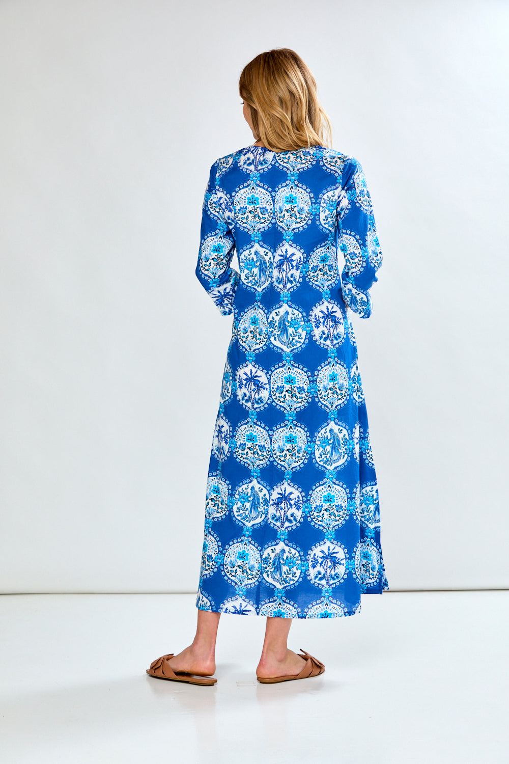 Woman in blue french tile caftan