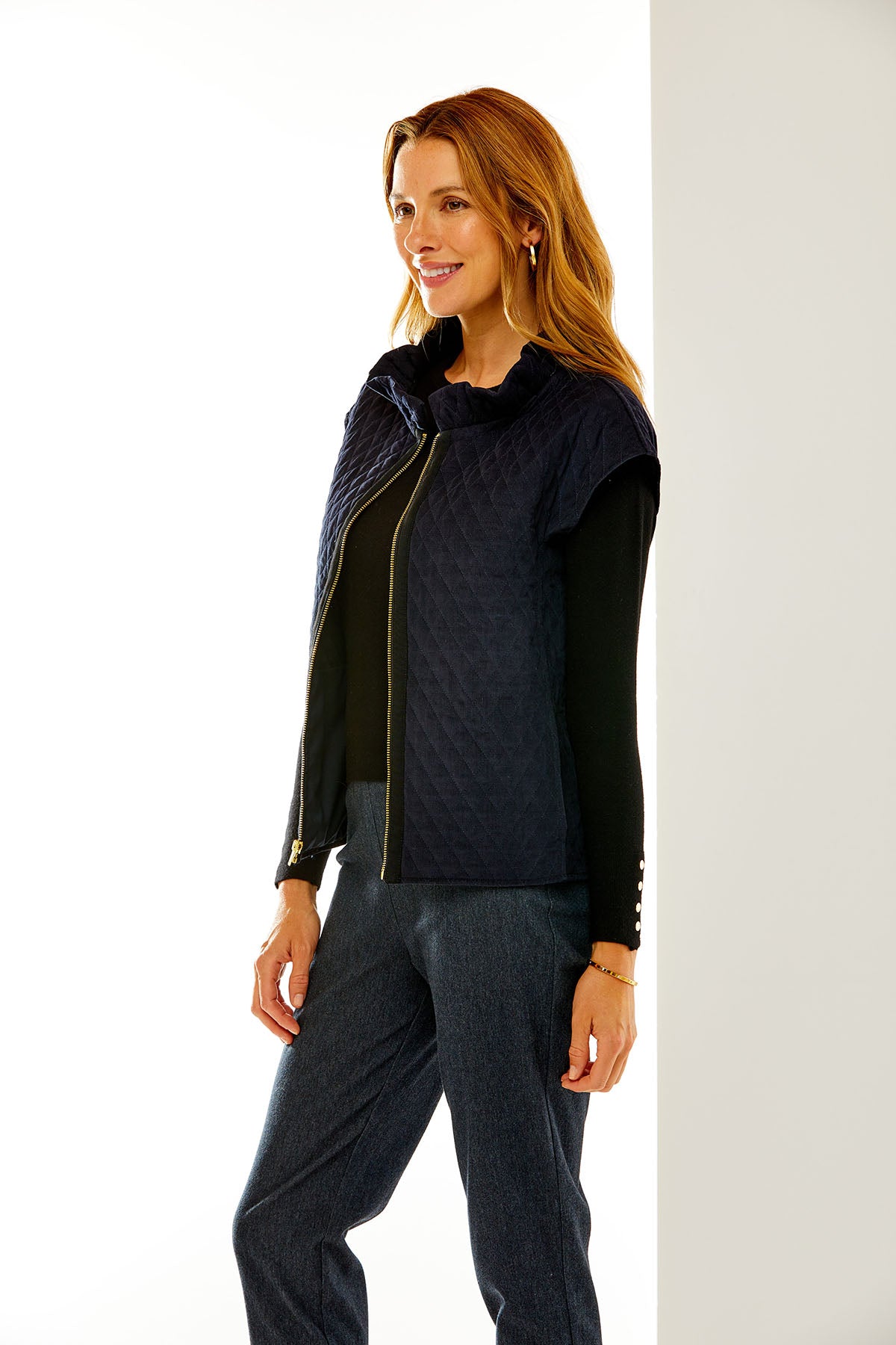 Woman in navy quilted corduroy vest
