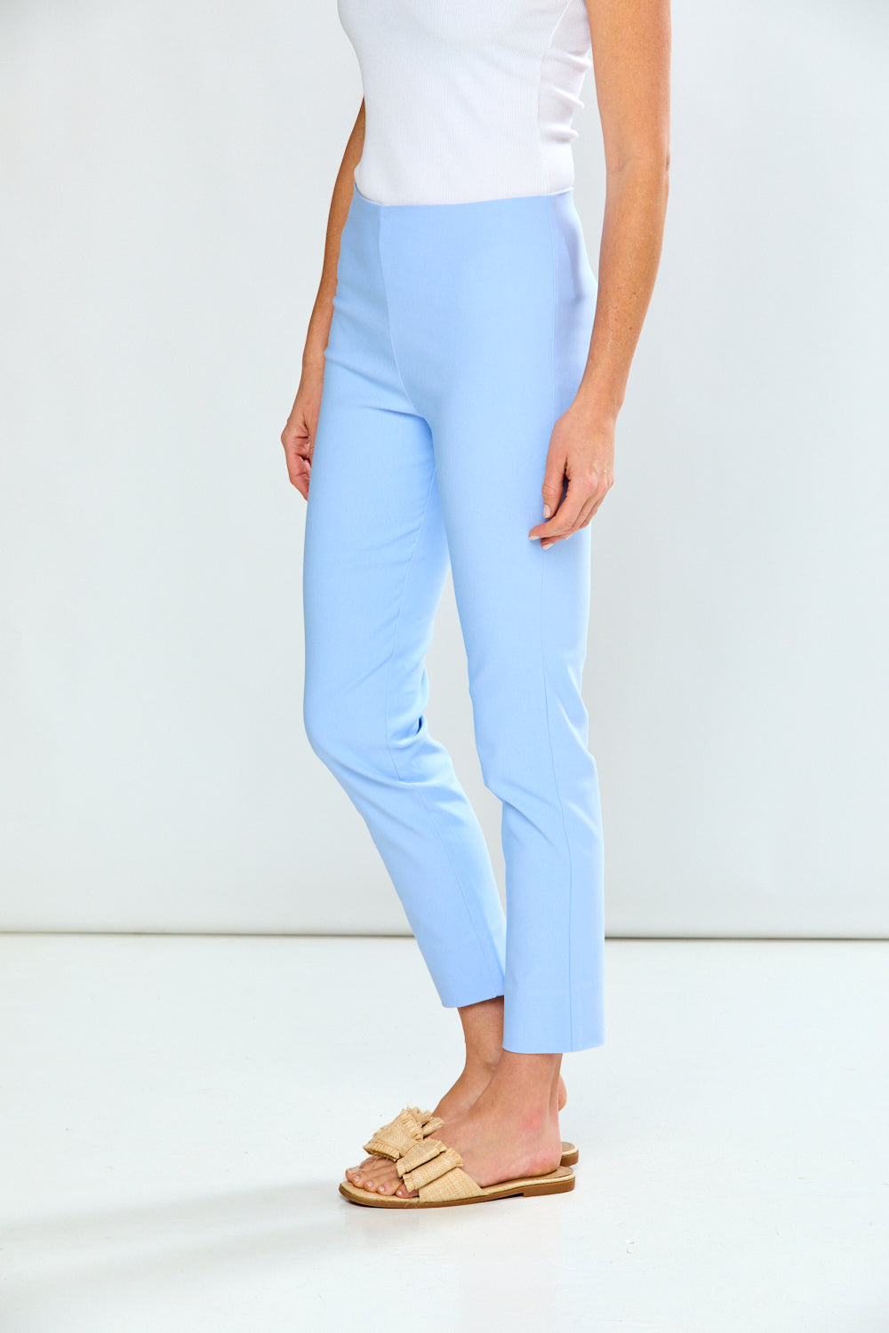 Light blue pants worn by a person on a white background