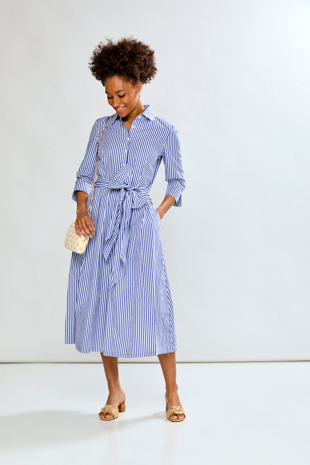 Woman in blue stripe dress