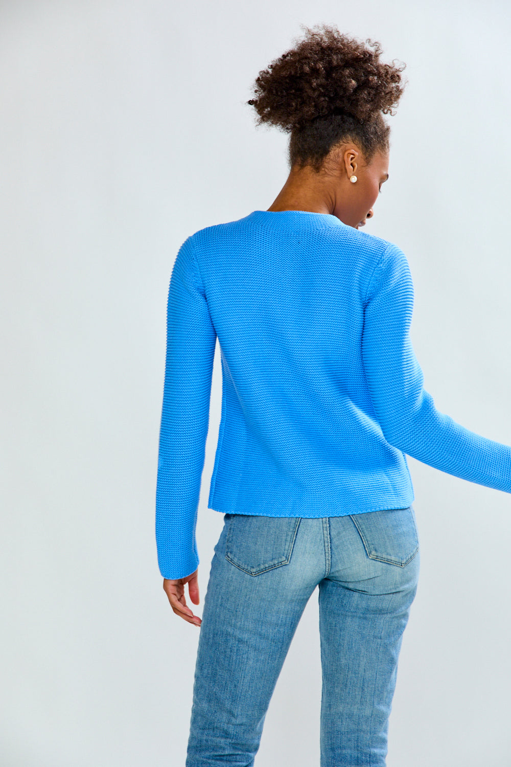 woman in periwinkle sweater
