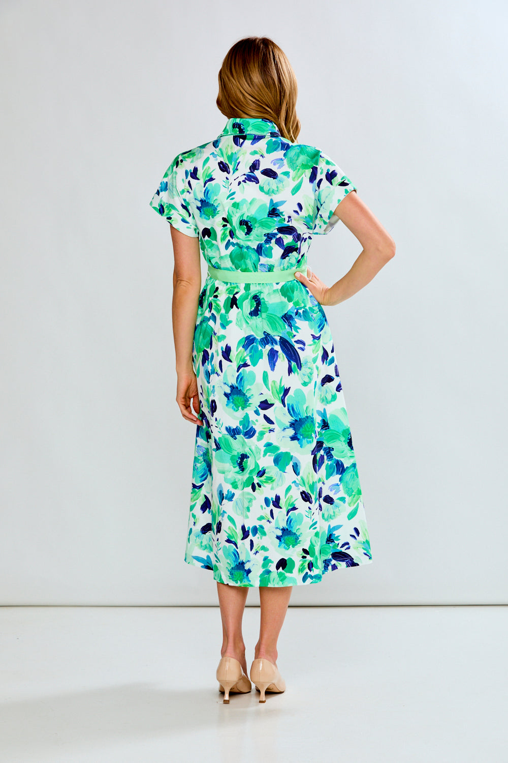 woman in green floral dress