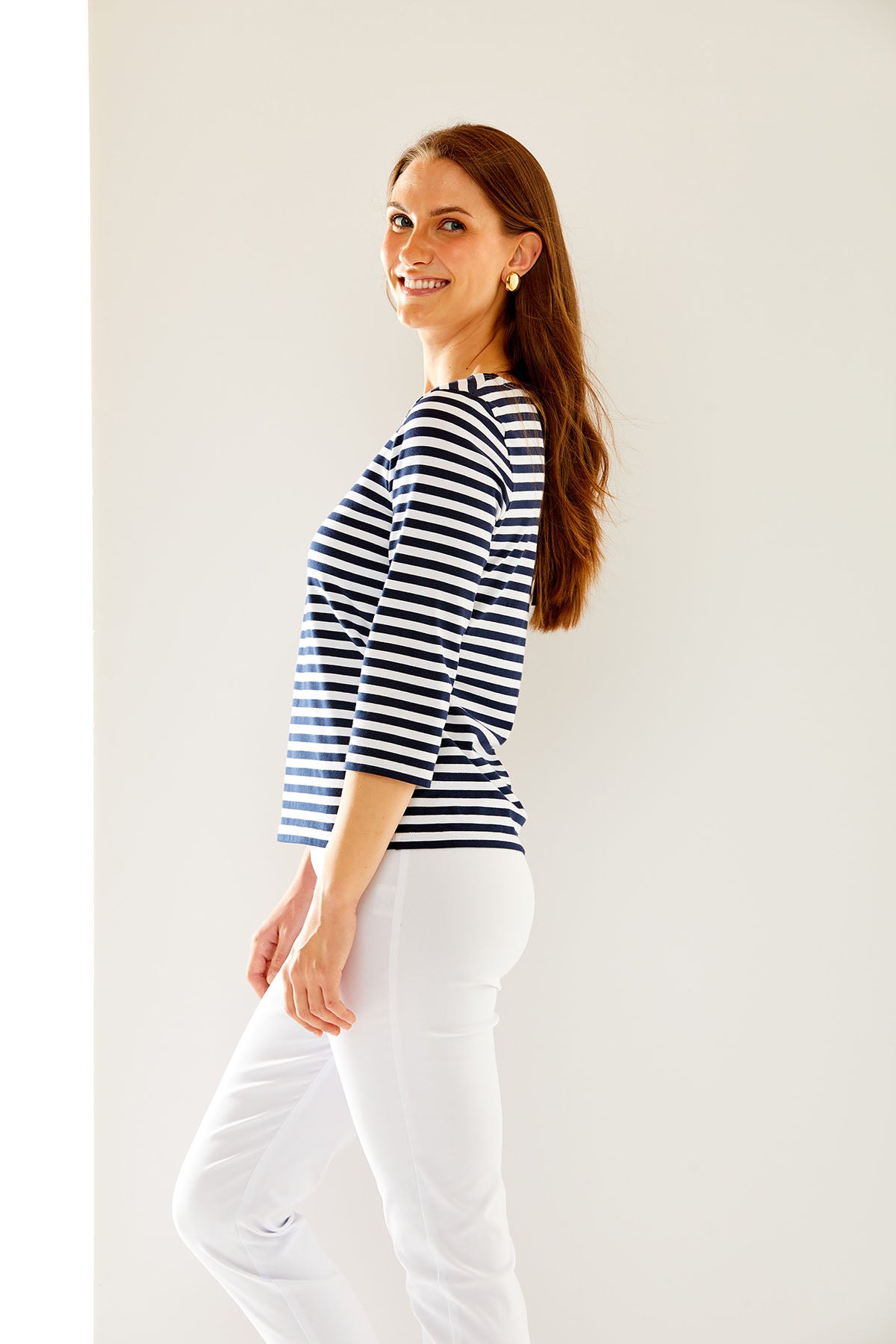 Woman in navy/white stripe top
