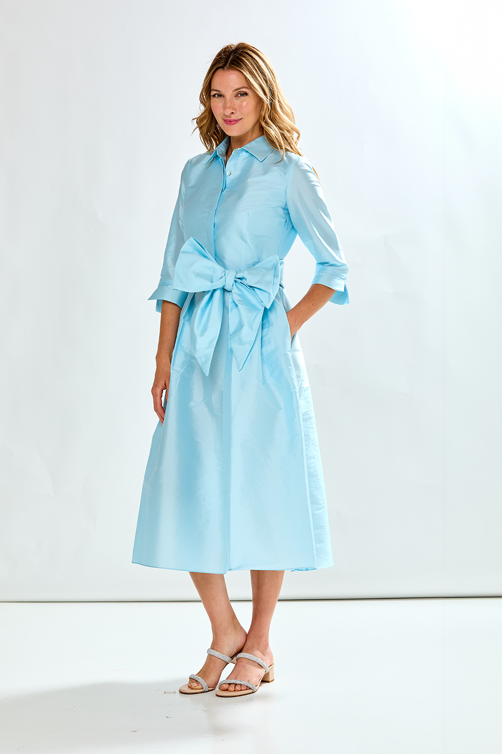 Woman in french blue taffeta dress