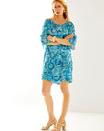 Woman in blue paisley dress