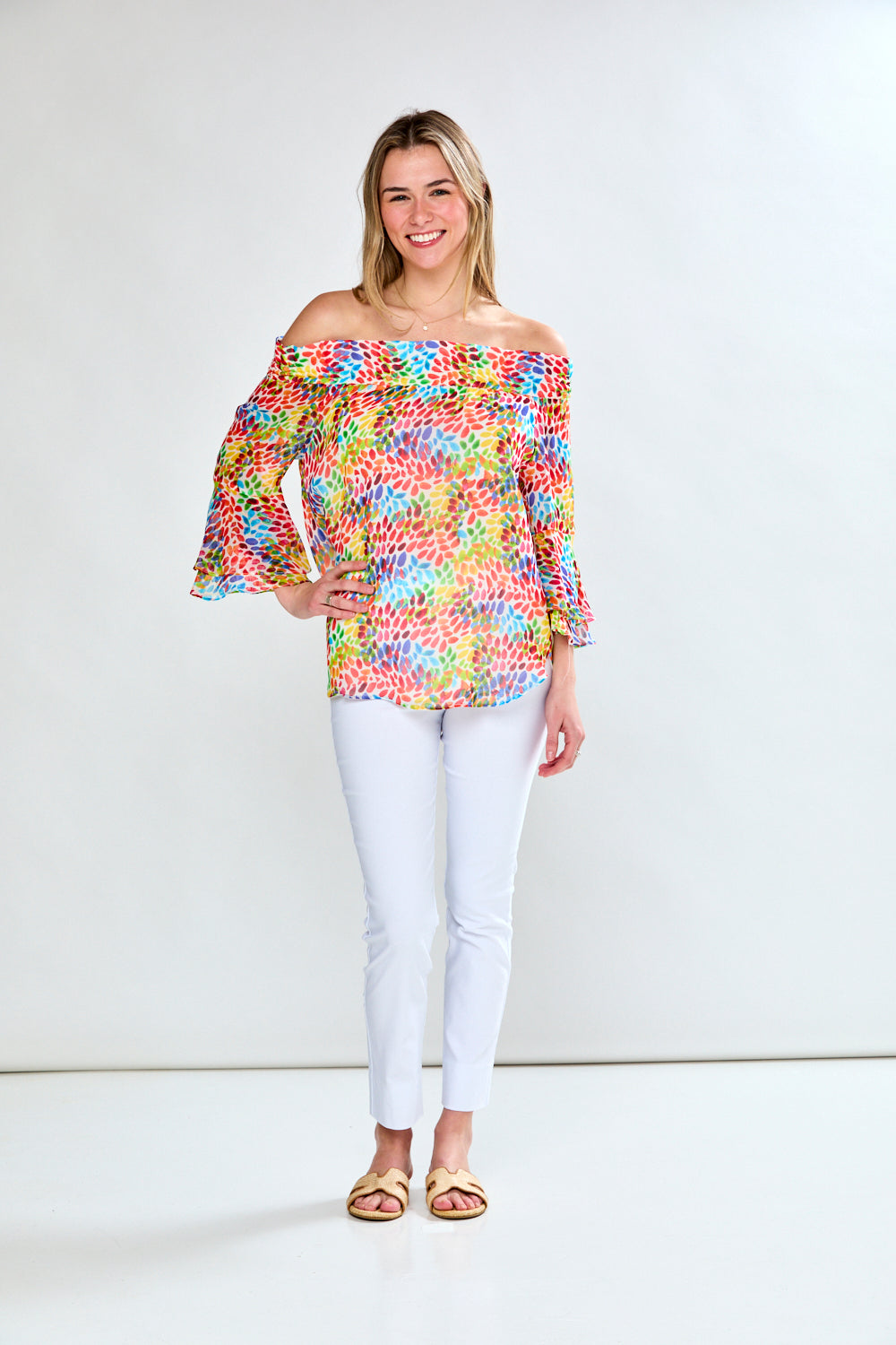 Woman in multi leaf print blouse