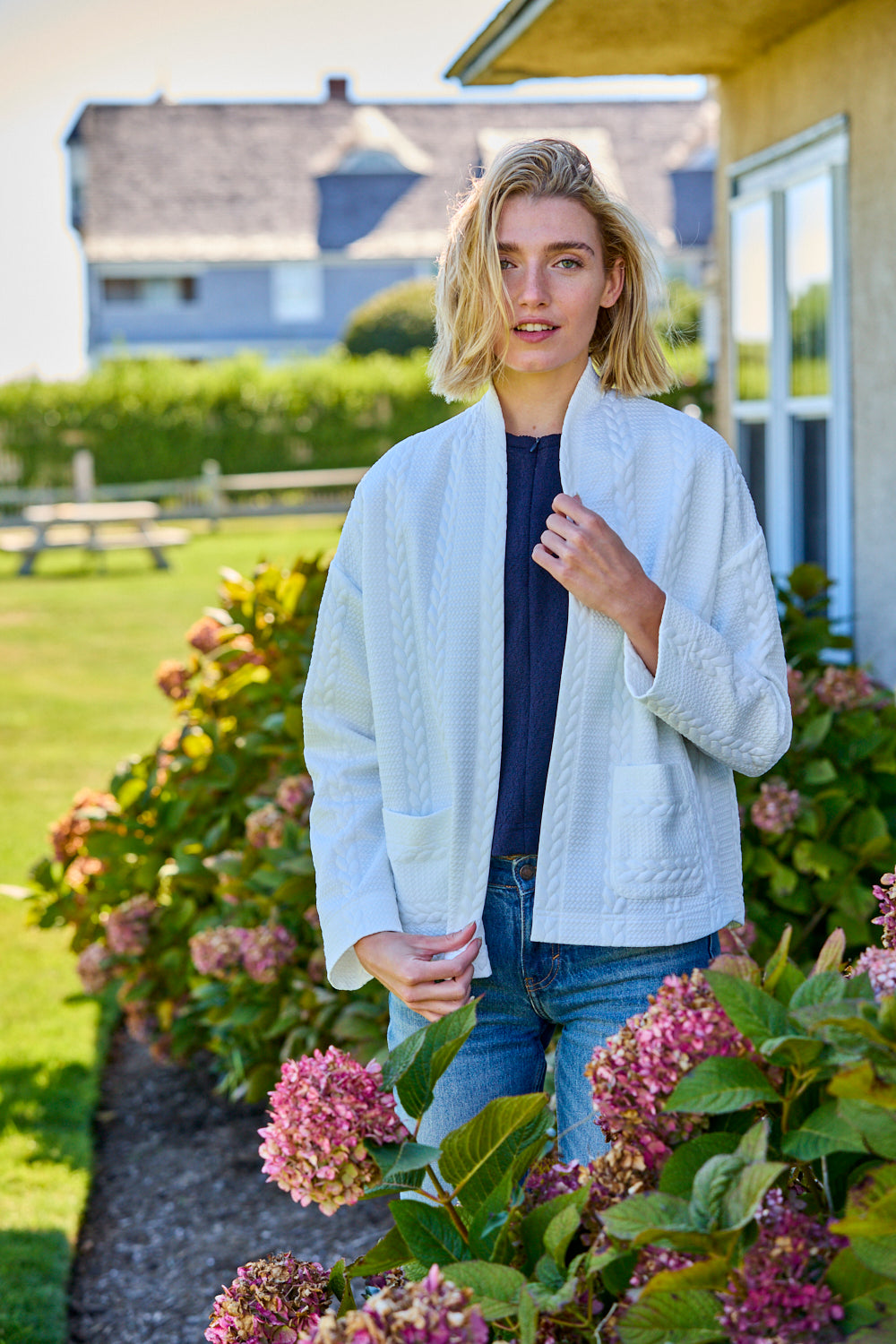 Woman with white open jacket on