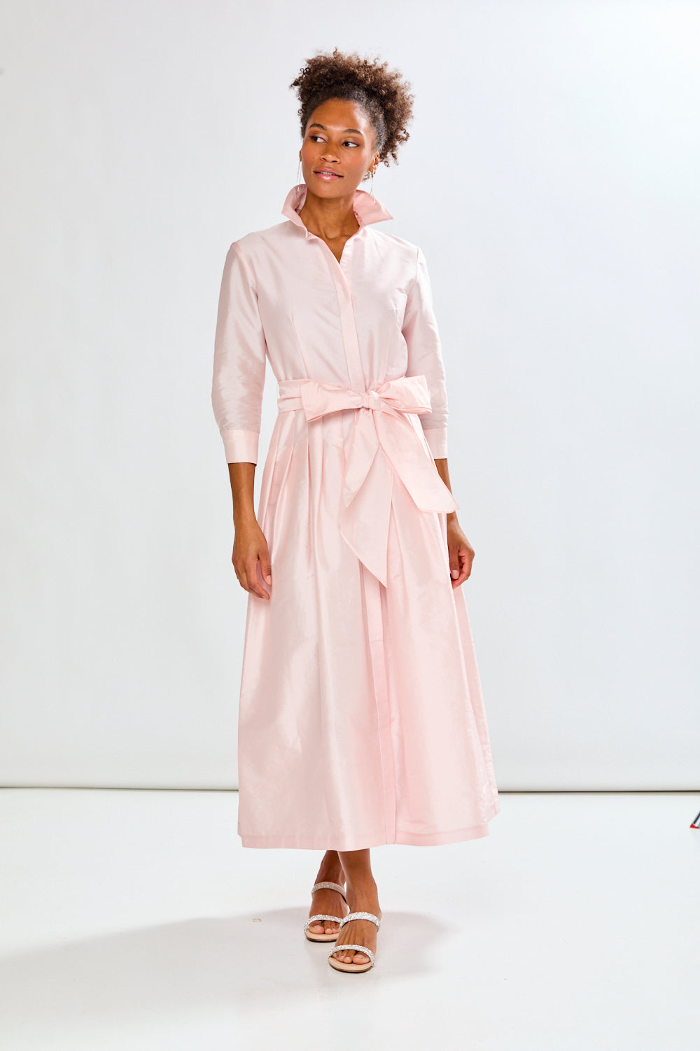 Woman in blush pink long taffeta dress