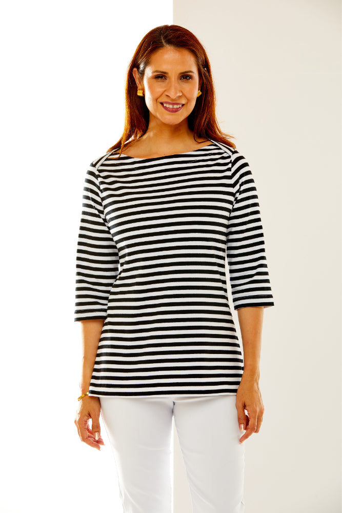 Woman in black and white striped top