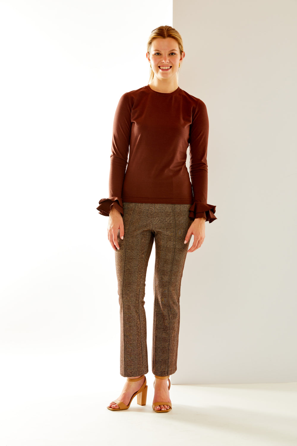 Woman in chocolate long sleeve top