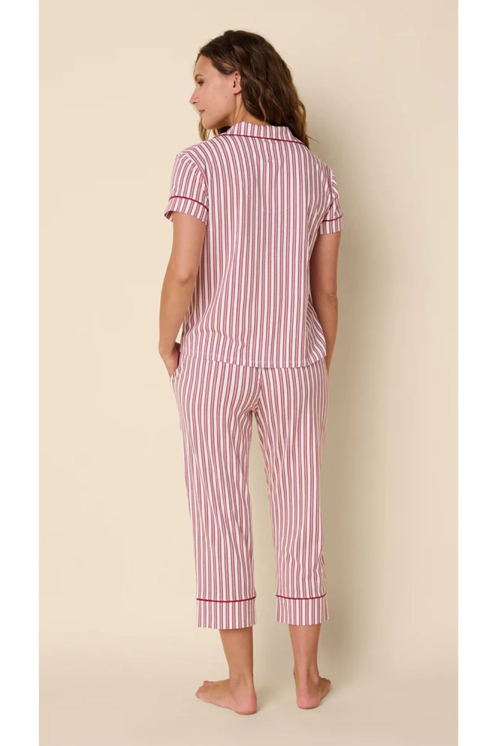 Woman in red and white striped pajamas